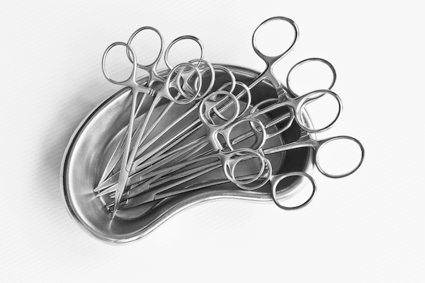 Surgical dish with a bunch of surgical forceps