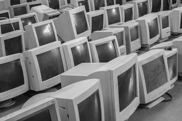 A room of older computer monitor screens