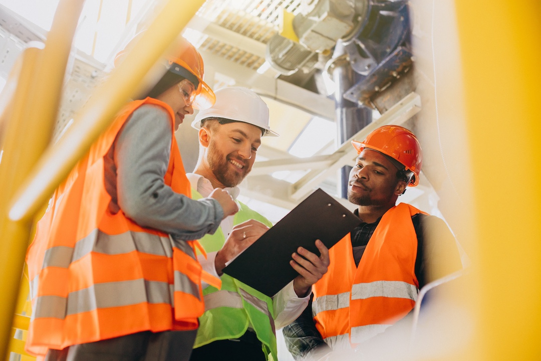 People discussing plan in a factory