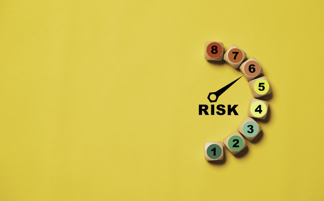 Risk meter image with hand pointing to 6